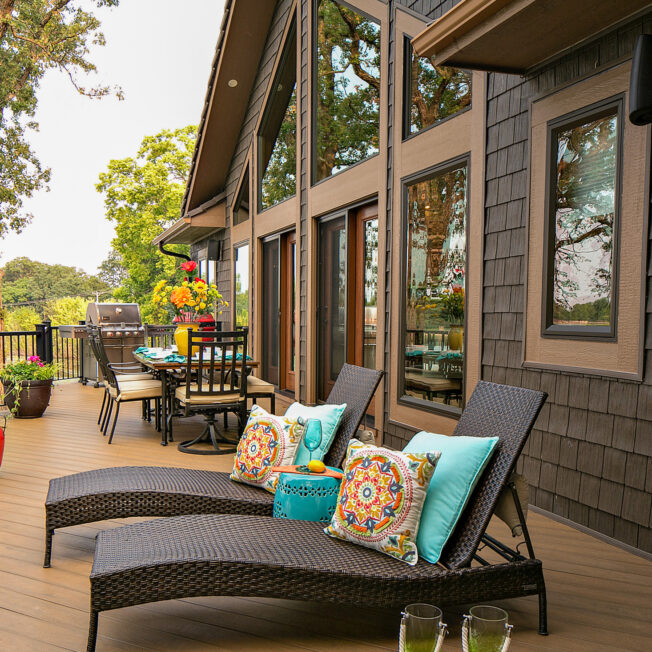 Shaped and picture windows in Rustic Bronze on the deck area of an A-frame house