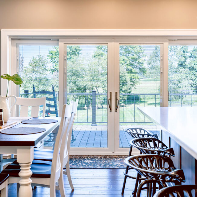 Inside view of an Endure 4-lite sliding patio door in white with white internal blinds