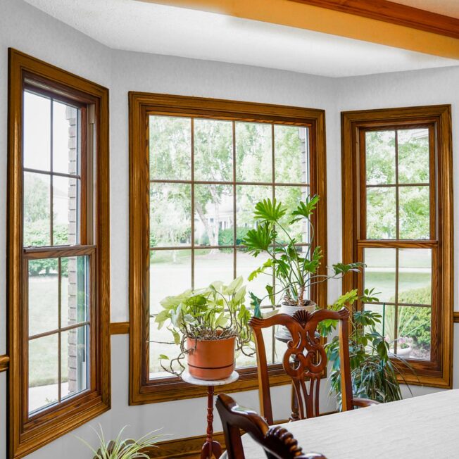 Aeris double hung and picture wood-clad windows in a dining room