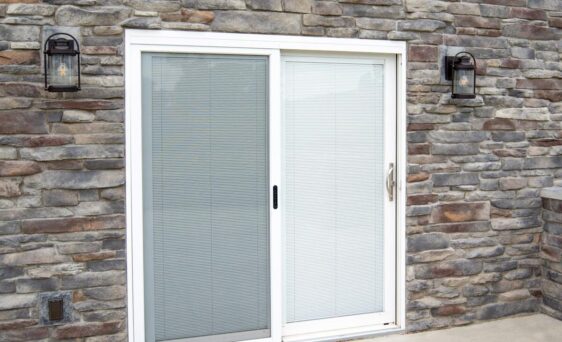 Outside view of one of ProVia's Aspect sliding replacement patio doors in White with Internal Blinds