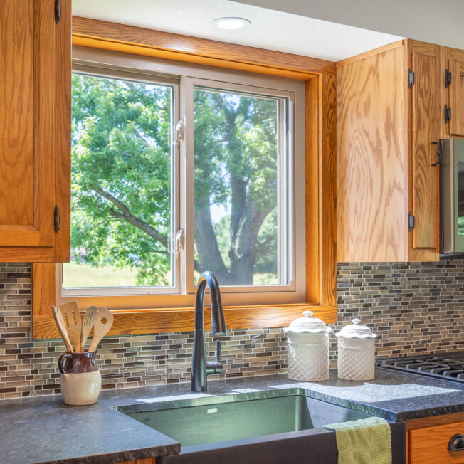 Inside view of Aspect slider windows in Sandstone beige above a kitchen sink