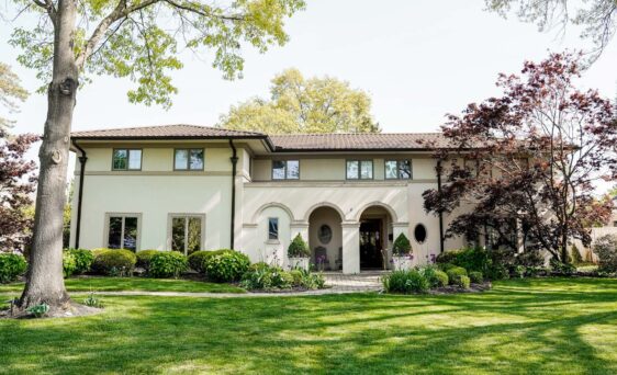 Spanish-style home with a nice front yard and ProVia barrel tile metal roofing