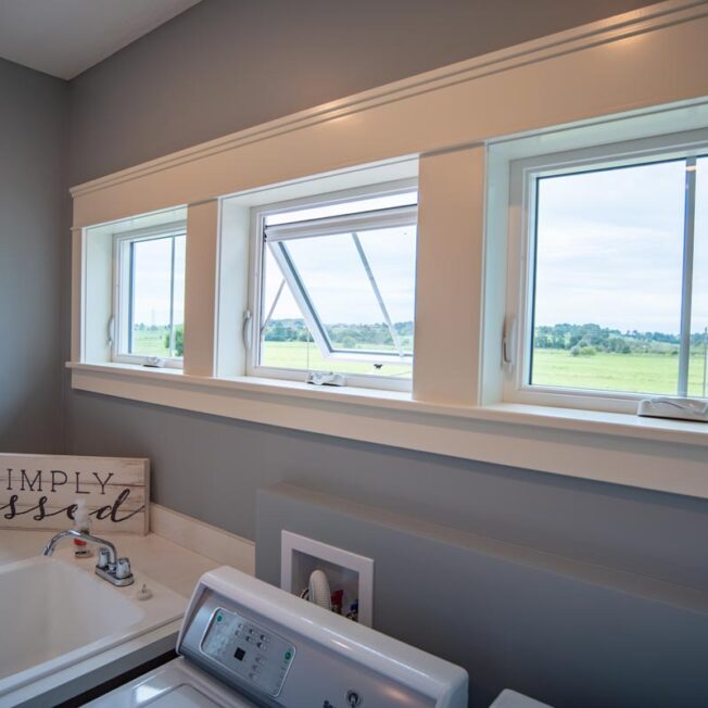 Endure White Awning Windows in Laundry Room; example of awning windows in ProVia's window gallery