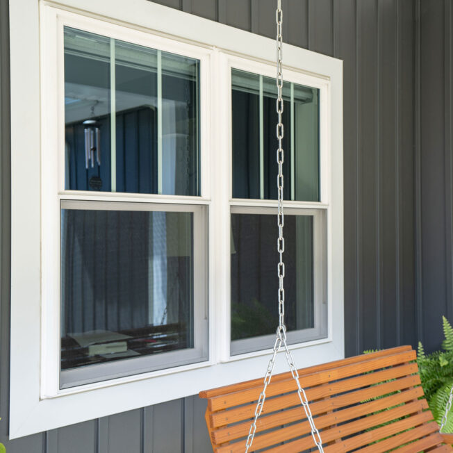 Outside view of white Endure double hung windows with two vertical grids on the top halves only