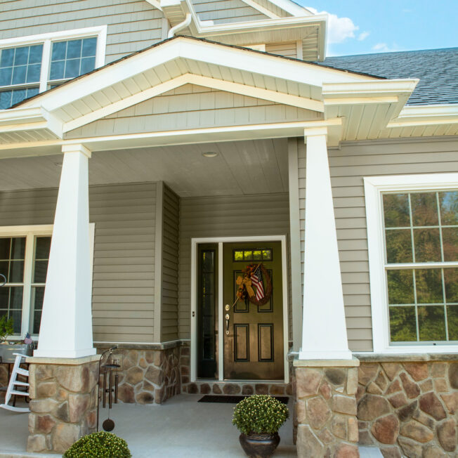 ProVia Fieldstone  Manufactured Stone knee wall on a home exterior in the color Old Dominion