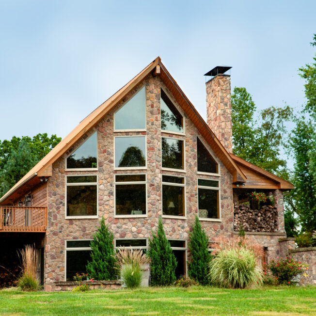 Brown and tan field stone veneer manufactured stone, Shenandoah, on an A-frame house