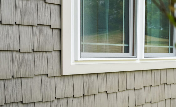 Closeup of Harbor Mill shingle and shake siding in the color Pueblo on a house