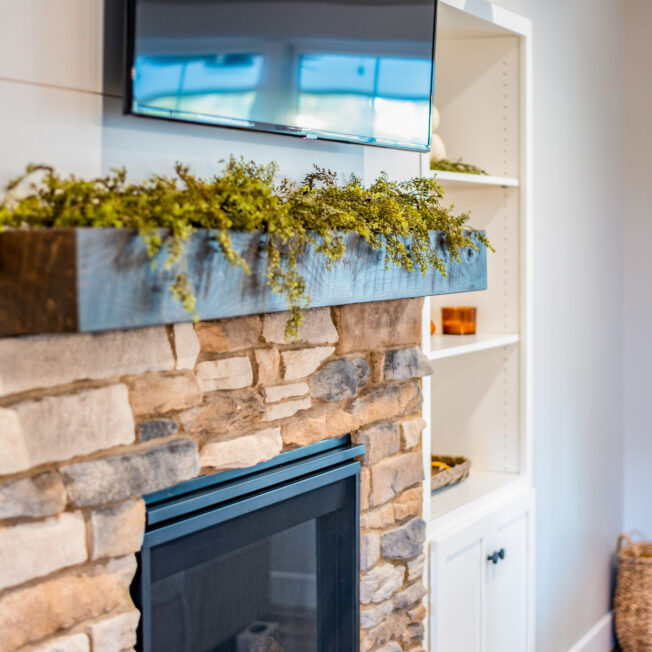 Inside image of a stone fireplace featuring ProVia's Ledgestone profile in Brighton, example of stone fireplaces, Ledgestone stone veneer for fireplaces