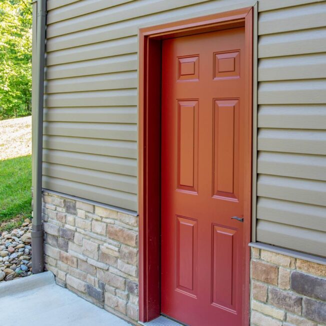 Legacy™ steel painted door in Mountain Berry red