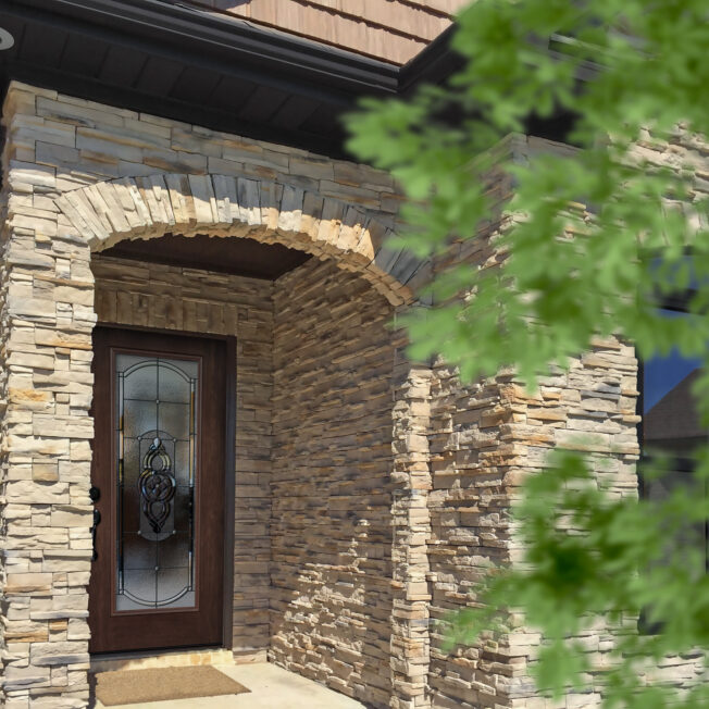 PrecisionFit stack stone veneer in Adobe Sands on a home's exterior