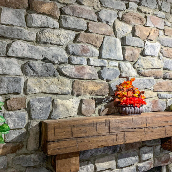 Inside image of a stone fireplace featuring ProVia's Ridge Cut profile in Castle Rock, example of stone fireplaces, Ridge Cut stone veneer for fireplaces