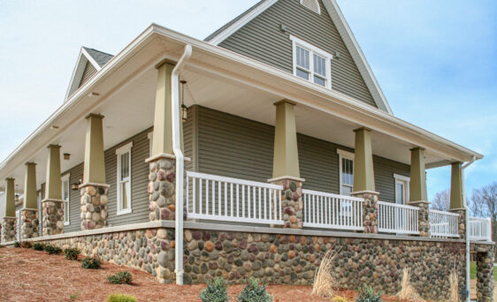 Michigan River Rock stone veneer on a home exterior, example of river rock house exterior application