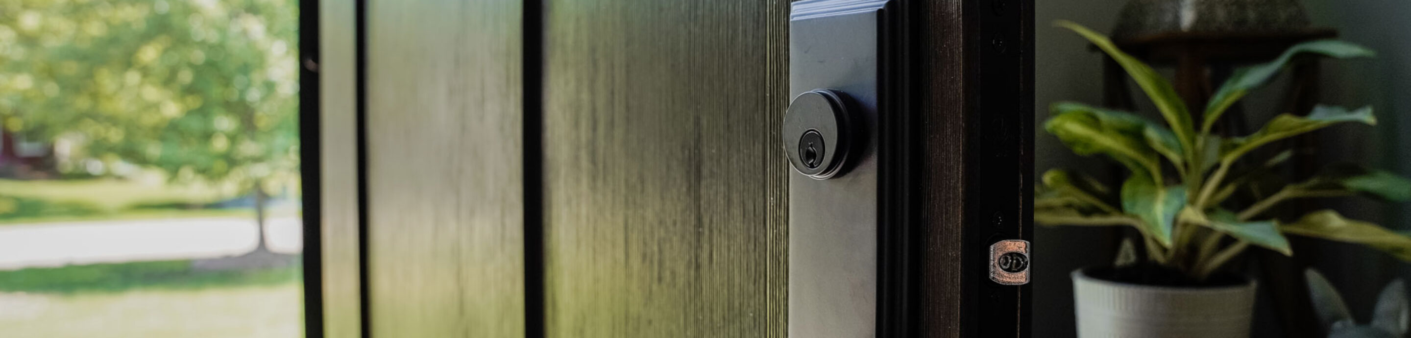 Close-up view of a Signet® Fir entry door in Espresso
