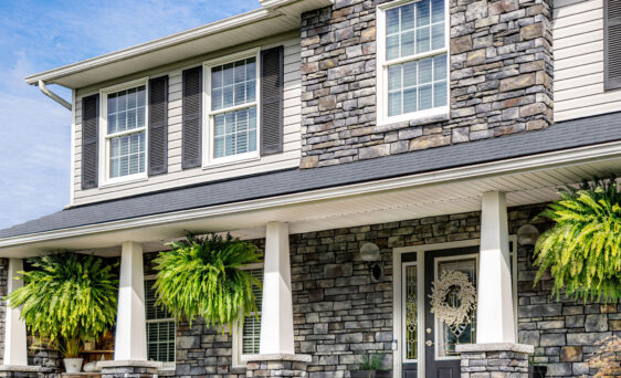 Picture of a two-story home with Terra Cut Stone Veneer, example of a home exterior stone application