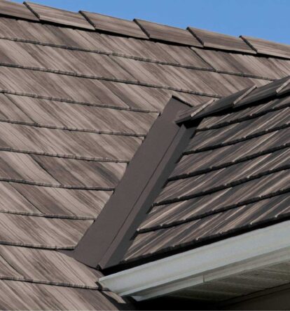 Closeup of a roof on a home showing ProVia's Briarwood Shake metal roofing with Briar Lodge Solid Trim