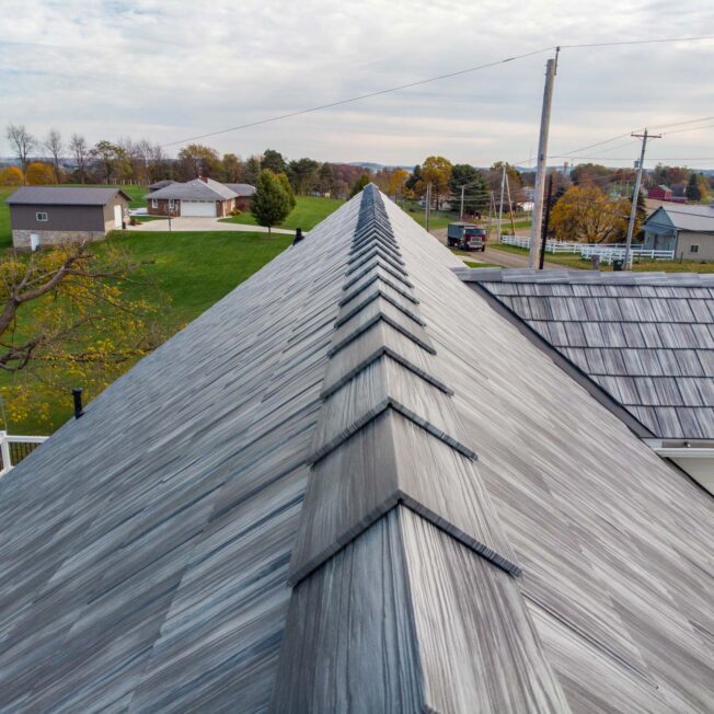 View of the top of ProVia metal roofing in gray Pepperwood Shake