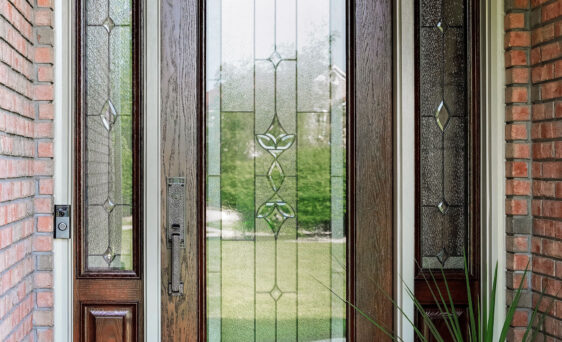 Signet® Oak 460 style entry door with a medium brown custom stain and Esmond Decorative Glass