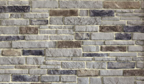 Chisel Cut™ Wellington manufactured stone veneer with Buff colored Grout