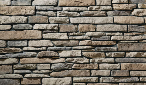 Closeup view of ProVia's Ledge Stone veneer in the color Brighton with Black stone grout