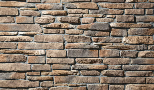 Closeup view of ProVia's Ledgestone veneer in the color Rushmore with Gray stone grout