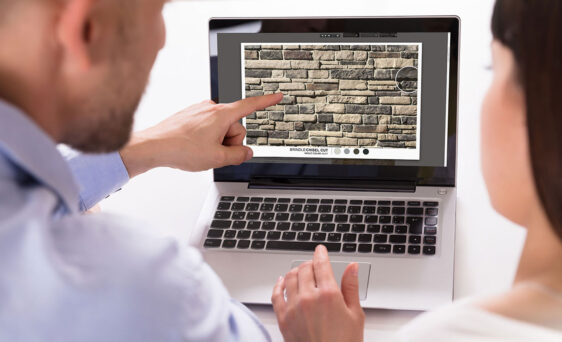 Couple using the stone and grout visualizer on a laptop