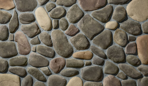 Closeup image of ProVia's River Rock stone veneer in a color called Michigan with Gray Grout