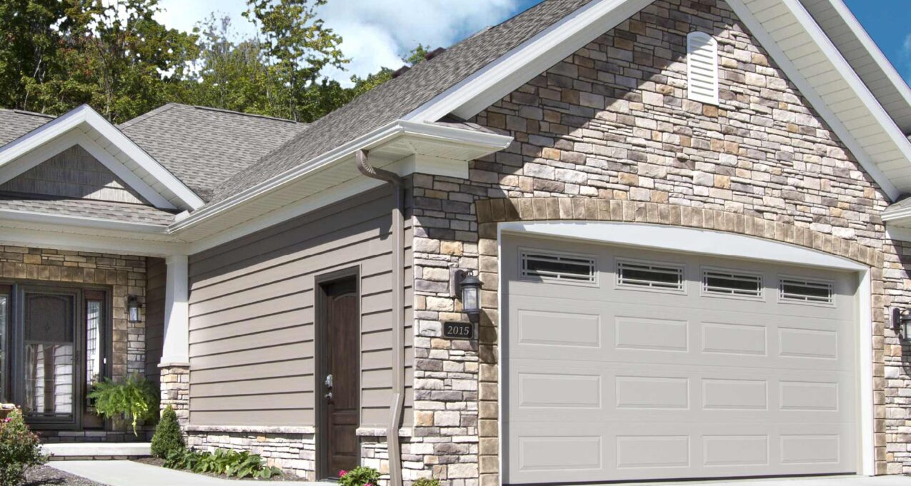 Home with exterior stone veneer on a sunny day, demonstrating how sunlight affects stone color