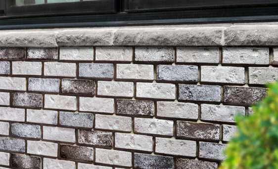 Thin Brick manufactured stone in the color Cobblestone on the exterior of a home