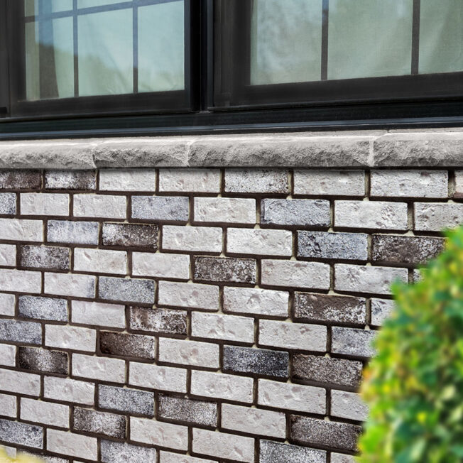 Thin Brick manufactured stone in the color Cobblestone on the exterior of a home