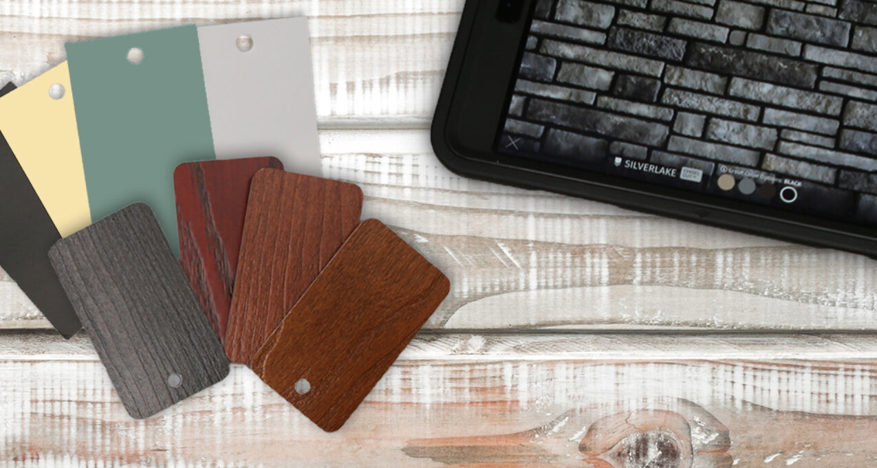 ProVia color samples on a wooden surface showing ideas that can be put together for house color schemes