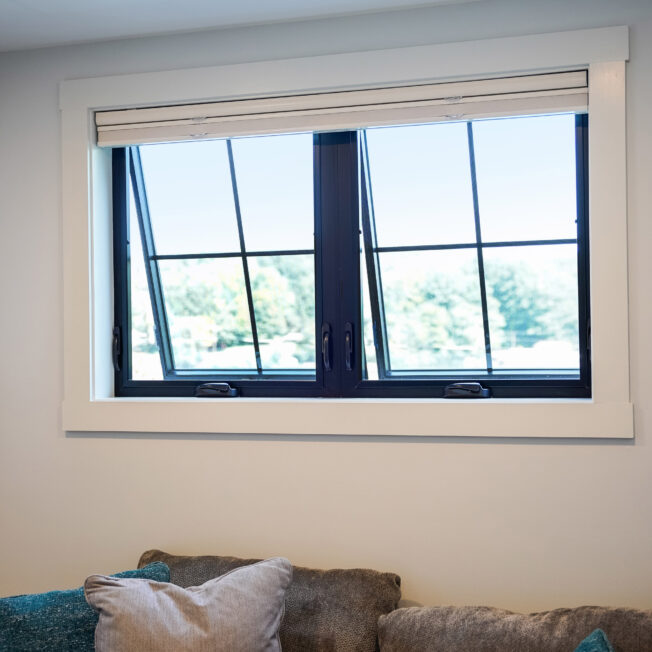 Inside view of ProVia's Endure awning windows in Textured Matte Coal Black with internal grids
