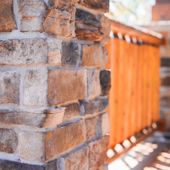 ProVia Terra Cut manufactured stone on a porch column in the color Russet, example of how exterior stone for houses can be used