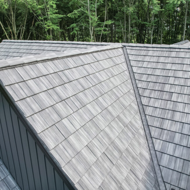 Home with ProVia's gray Shadewood Shake metal shingle roof showing that metal roofing can resemble the look of shake shingles