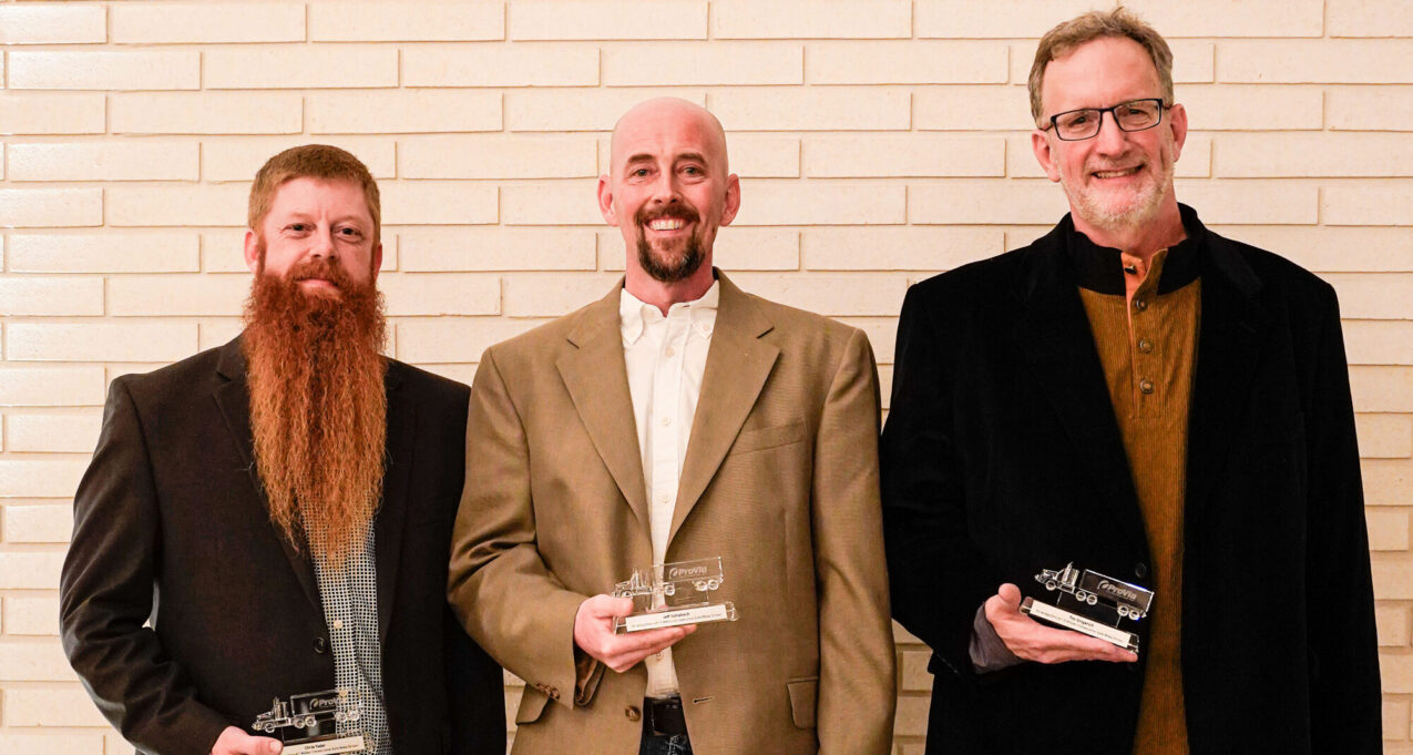 ProVia truck drivers Chris Yoder, Jeff Schlabach, and Tim Gingerich pose with awards as they were inducted into the Million Mile Club