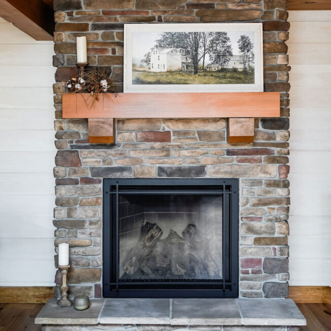 Interior image of a floor-to-ceiling fireplace featuring ProVia Ledgestone in Saginaw with Fieldstone in Pennsylvania Manufactured Stone Fireplace