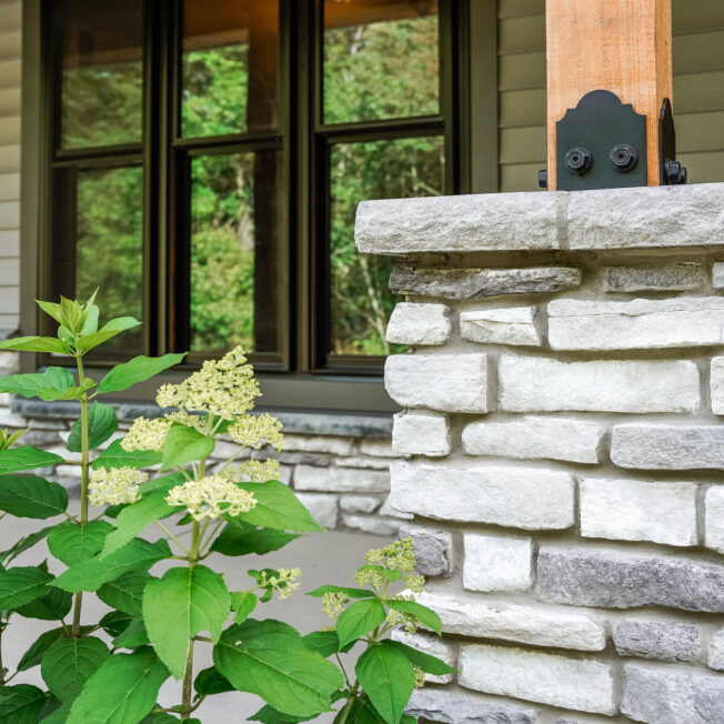 Closeup of ProVia Terra Cut™ Frost Manufactured Stone on a home exterior and porch column