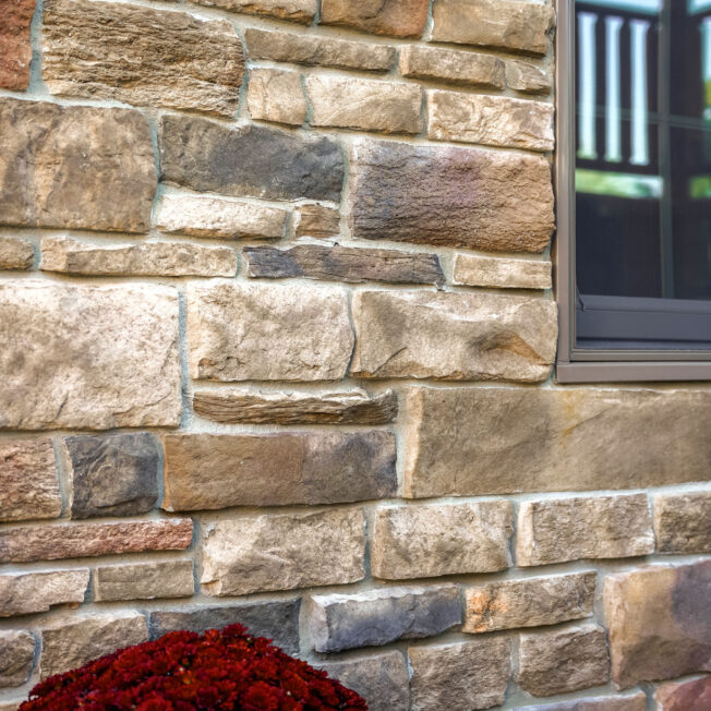 Closeup of ProVia Terra Cut™ Russet Manufactured Stone on home exterior