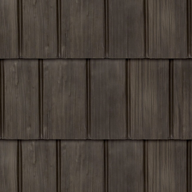 Closeup image showing the details of ProVia's Bronzewood dark brown colored shake metal shingle roof, example of metal roofing that looks like shake