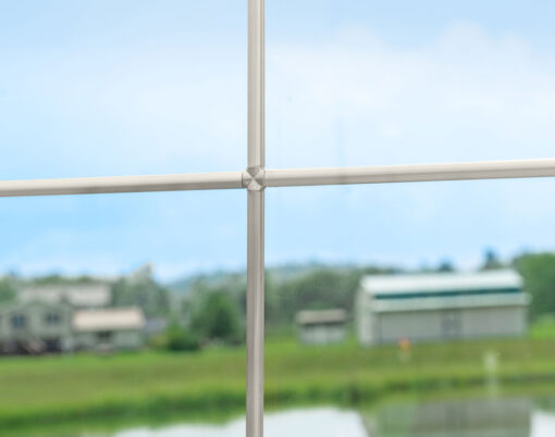 Closeup view of pencil entry door grid option in the color Satin Nickel